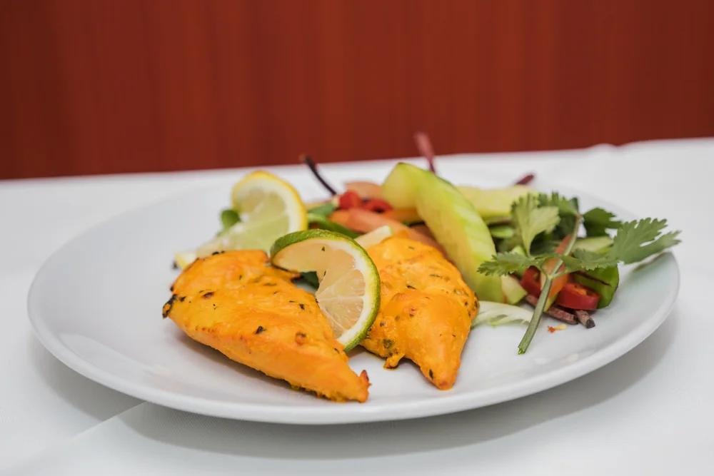 Indian starter with lemon and fresh salad