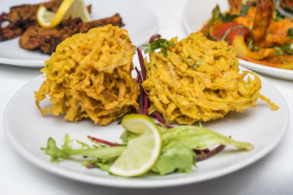 Crisp Indian appetisers plated with salad